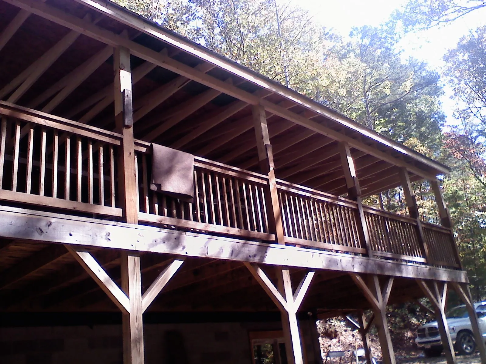 Timber framing under a new elevated porch and deck — Roof Leak Repair in West Yarmouth by Roofing Brothers